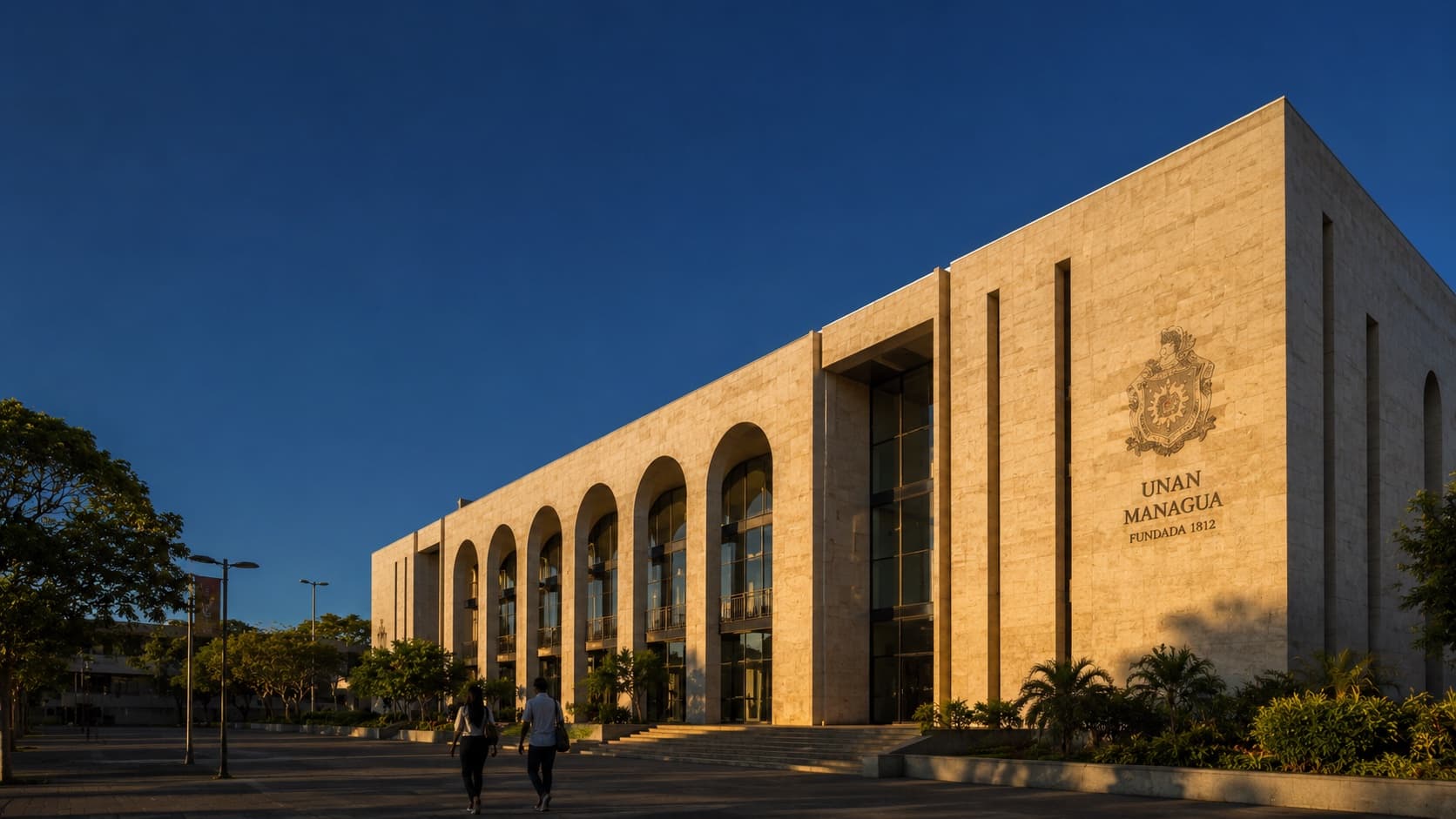 The civic-scale exterior of NIGA's main Managua campus at late afternoon